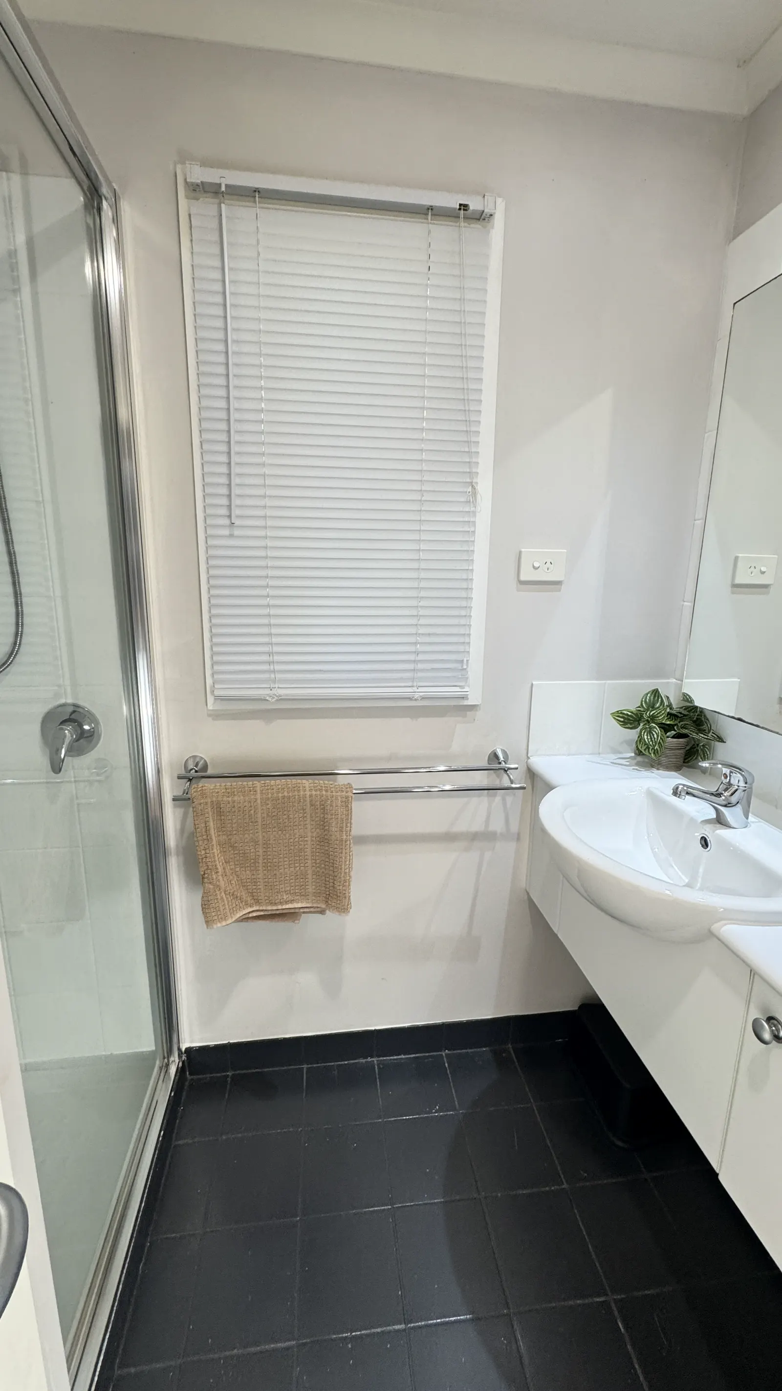 Bathroom with a bathtub, shower curtain and vanity — Two-bedroom Villa 107, Cowes, Phillip Island
