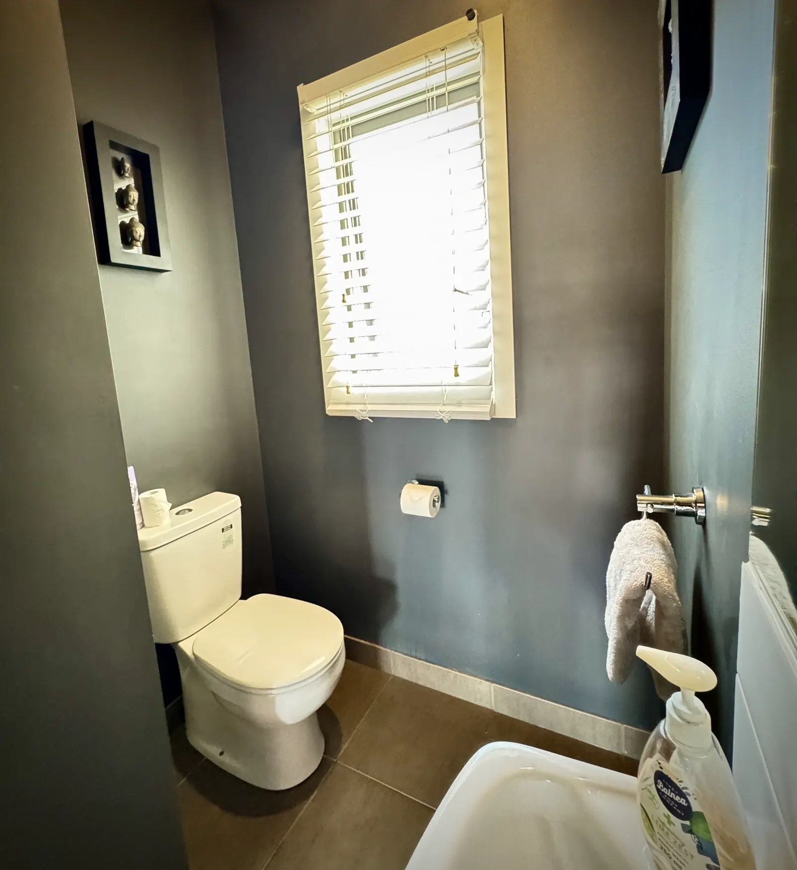 Separate toilet with a window and hanging towels — Coastal Tones holiday home, Cowes, Phillip Island
